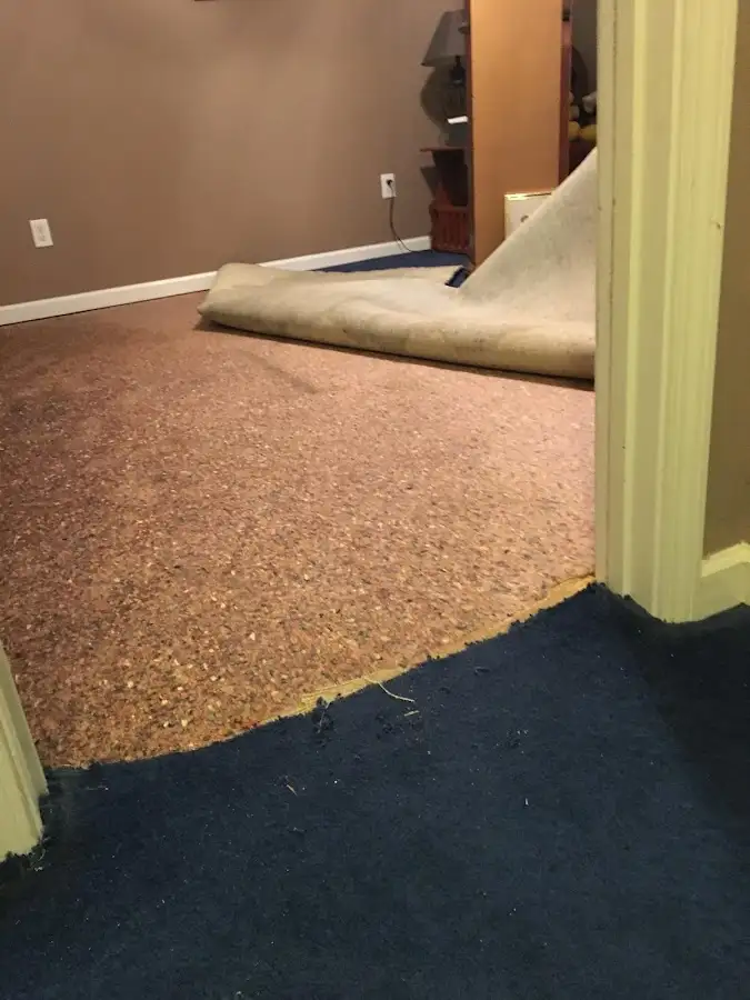Carpet pad removal revealing water damage during Drying & Dehumidification in Wichita Falls